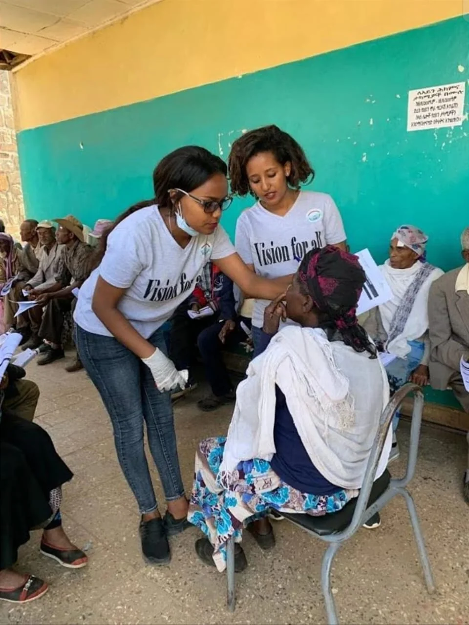 Eye examination and optometry healthcare service being provided in an African community