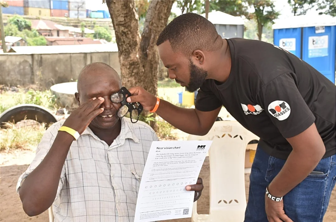 Volunteers providing community outreach service and helping people in an African village setting